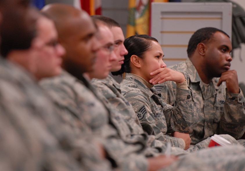 Audience members react to a sexual assault theater group skit Dec. 19, 2012, at Kunsan Air Base, Republic of Korea. The 8th Fighter Wing sexual assault response program office revived their performance group to open another source of dialogue for Wolf Pack members.  (U.S. Air Force photo by Staff Sgt. Tong Duong/Released)