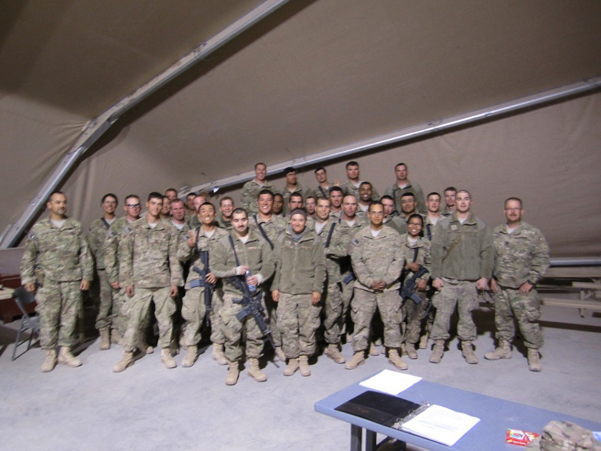 CAMP JOHN PRATT, Afghanistan – Airmen from the 554th RED HORSE Squadron pose for a group photo at Camp John Pratt, Afghanistan, in October 2012. The 554th RHS Airmen have been executing a critical $31 million construction program spanning from the Middle East to Central Asia while deployed. (Courtesy photo)