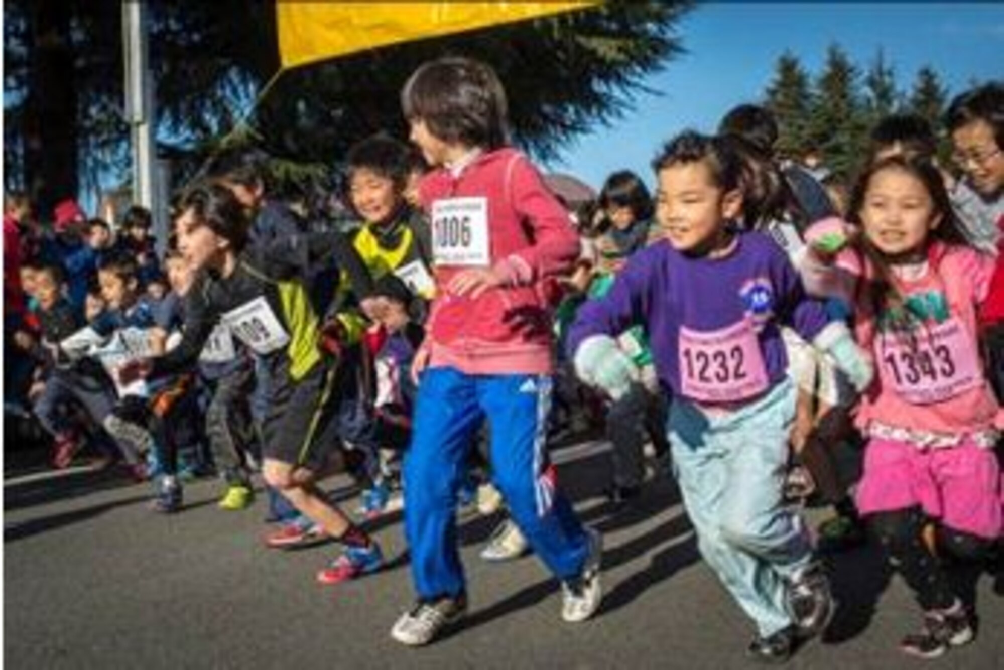 A group of Japanese children begins the 2K race during the annual Frostbite Run Jan. 13, 2013, at Yokota Air Base, Japan. Team Yokota welcomed more than 10,000 Japanese runners from the local area during the annual event. (U.S. Air Force photo Capt. Raymond Geoffroy)