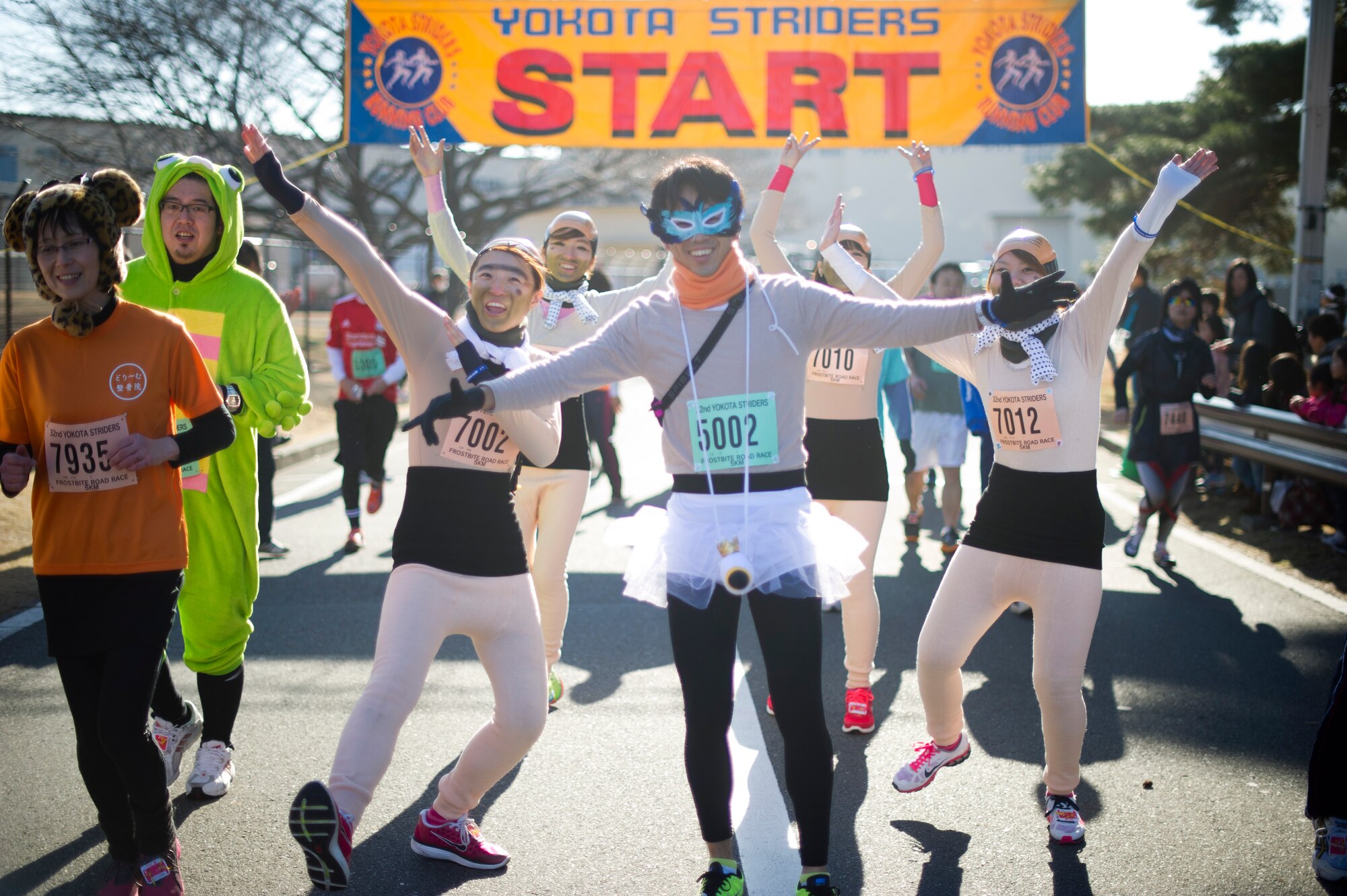 YOKOTA AIR BASE, Japan -- Costumed  Japanese  runners begin the 5k race at the annual Frostbite Run Jan. 13, 2013, at Yokota Air Base, Japan. Many of the runners chose to wear funny or creative costumes for the run.  (U.S. Air Force photo by Staff Sgt Stacy Moless)
