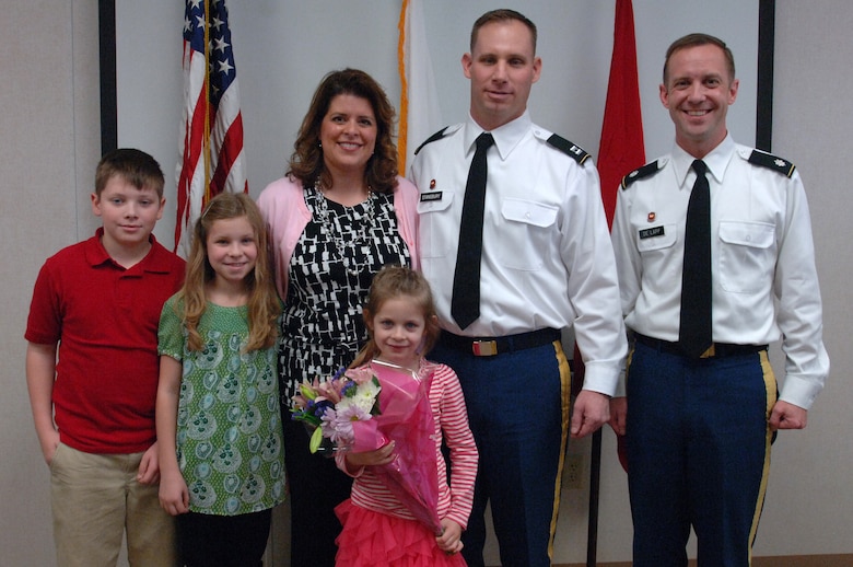 (Left to right) Ben, Taylor, Nancy, Kendall and Capt. Allen Stansbury, and Lt. Col. James A. DeLapp, U.S. Army Corps of Engineers Nashville District commander.  DeLapp poses with the Stansbury family following the captain's promotion at the Wolf Creek Resident Engineer Office in Jamestown, Ky., Jan. 11, 2013. (USACE photo by Leon Roberts)