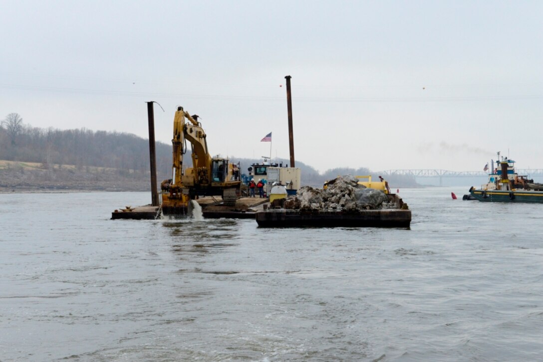 The removal of 890 cubic yards of limestone from the navigation channel on the Mississippi River near Thebes, Ill., began Dec. 17, 2012. This is just one phase of the action the Corps is taking to improve the navigation channel for the river industry.