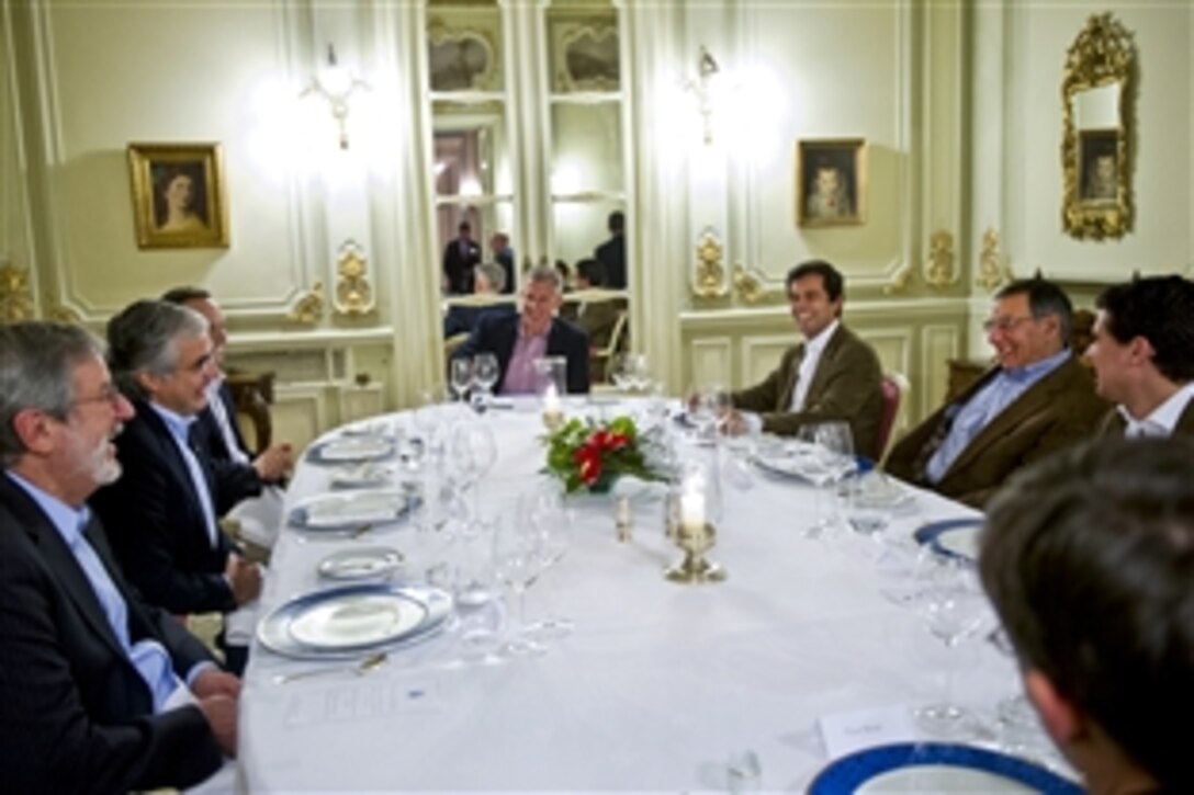 U.S. Defense Secretary Leon E. Panetta, center right, and Portuguese Minister of Defense, José Pedro Aguiar-Branco, opposite, meet for dinner in Lisbon, Portugal, Jan. 14, 2013. Panetta is on a six-day trip to Europe to visit defense counterparts and U.S. troops. 