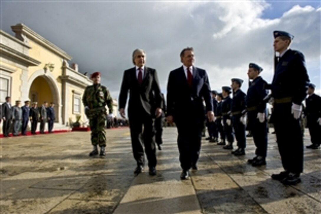 U.S. Defense Secretary Leon E. Panetta conducts a pass and review with Portuguese Defense Minister Jose Pedro Aguiar-Branco in Lisbon, Portugal, Jan. 15, 2013. Panetta is on a six-day trip to Europe to visit with defense counterparts and U.S. troops.