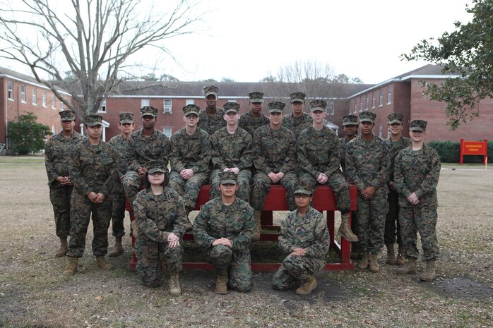 Female Marines with Combat Logistics Regiment 27, 2nd Marine Logistics Group pose in front of the Headquarters Company office aboard Camp Lejeune, N.C., Jan. 15, 2013. They gathered here in honor of retired Brig. Gen. Margaret A. Brewer, the first female general officer in the Marine Corps, who recently passed away. (U.S. Marine Corps photo by Sgt. Rachael K. A. Moore)
