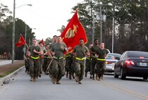 Col. Gary F. Keim (left), the commanding officer of Combat Logistics Regiment 27, 2nd Marine Logistics Group, and Sgt. Maj. Anthony L. Crutcher, the sergeant major of CLR-27, set the pace during a formation run aboard Camp Lejeune, N.C., Jan. 11, 2013. This is Keim’s first time hosting a regimental physical training session since assuming command, and he says he plans to host them once a month.