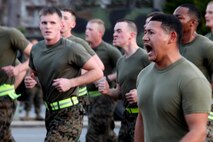 A Marine motivates other Marines of Combat Logistics Regiment 27, 2nd Marine Logistics Group during a formation run aboard Camp Lejeune, N.C., Jan. 11, 2013. During formation runs, Marines run side by side and chant cadences as loud as they can.