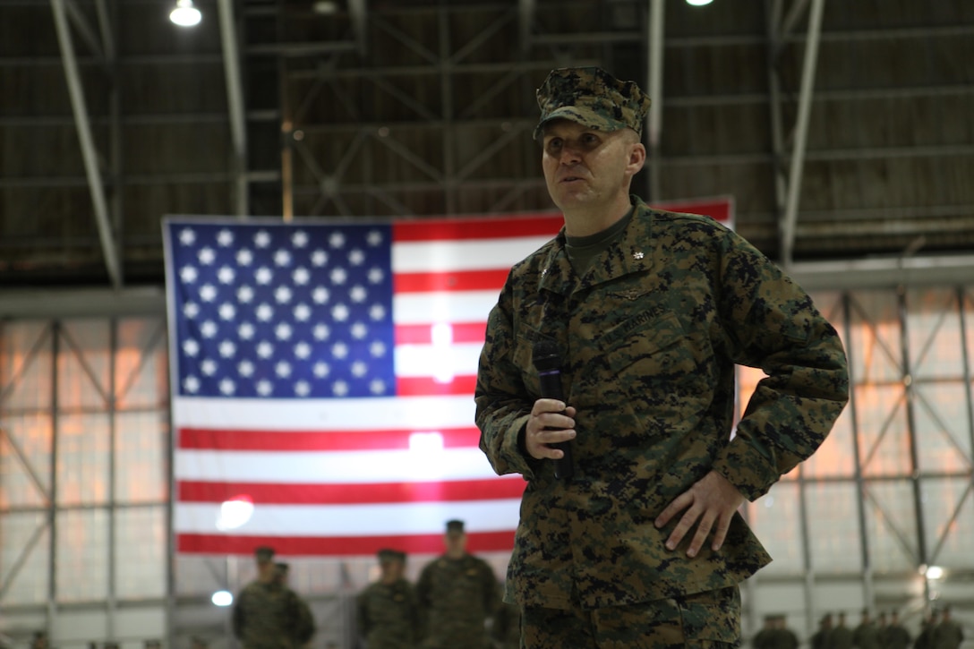 The first commanding officer of a Marine Reserve Osprey squadron, Lt. Col. David A. Weinstein, an Osprey pilot, addresses service members, family and friends after a change of command ceremony at Edwards Air Force Base near Lancaster, Calif., Jan. 12, 2013. Weinstein took command of Marine Medium Helicopter Squadron 764 (HMM-764) before the unit was re-designated to Marine Medium Tiltrotor Squadron (VMM-764).  The Marine Forces Reserve's first tiltrotor squadron has to establish programs, obtain qualifications and pass inspections before it can receive its first aircraft, expected in November 2013. The unit is expected to be a fully operational tiltrotor squadron by mid-2014. (U.S. Marine Corps photo by Sgt. Ray Lewis/Released)