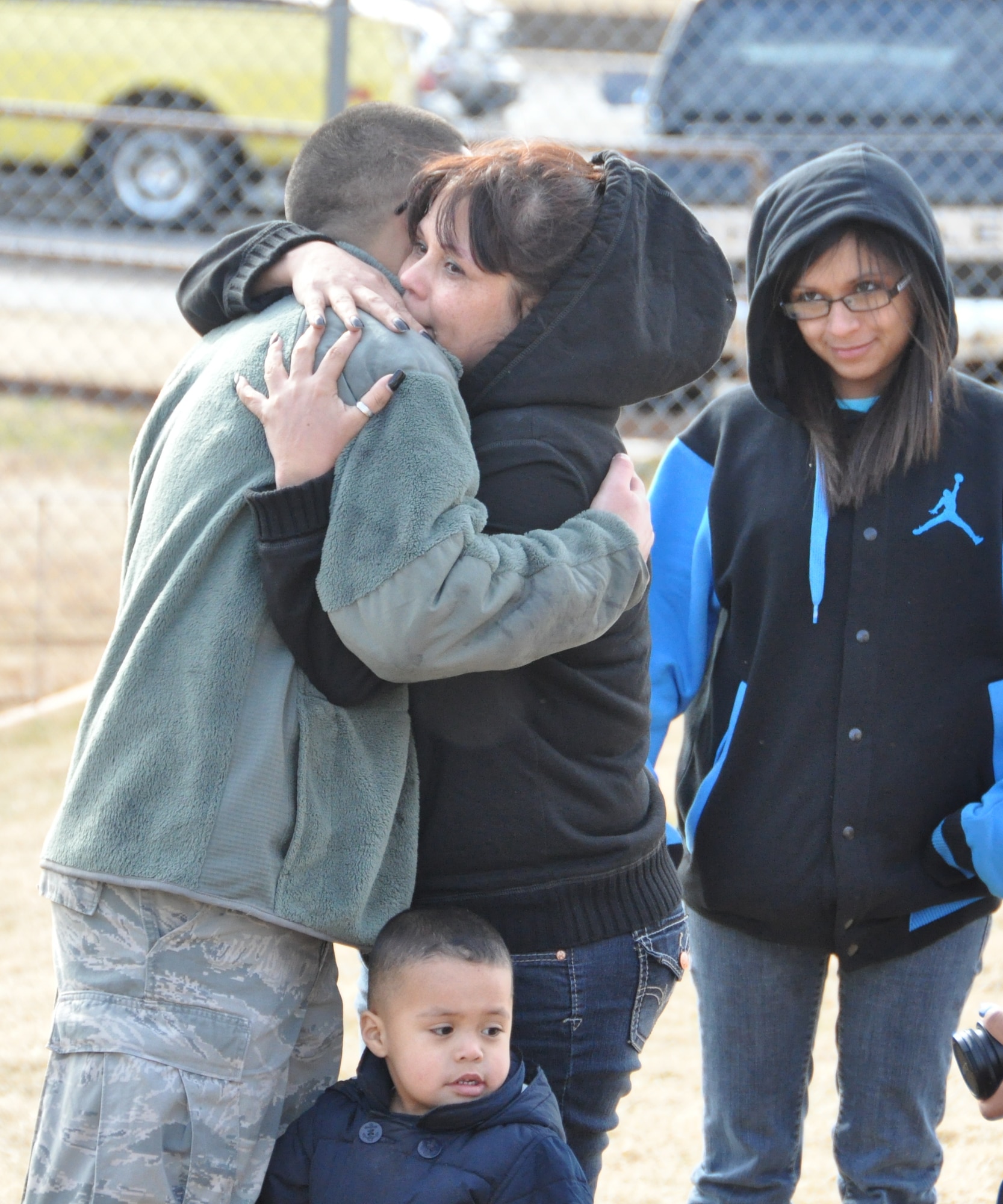 Airman 1st Class Jesus Lerma, 507th Aircraft Maintenance Squadron, hugs his mother before processing the deployment line here Jan. 5. Lerma is one of 130 reserve Airmen who deployed to Southwest Asia in support of operations in the U.S. Central Command area of responsibility early this month. (U.S. Air Force photo by Senior Airman Mark Hybers)