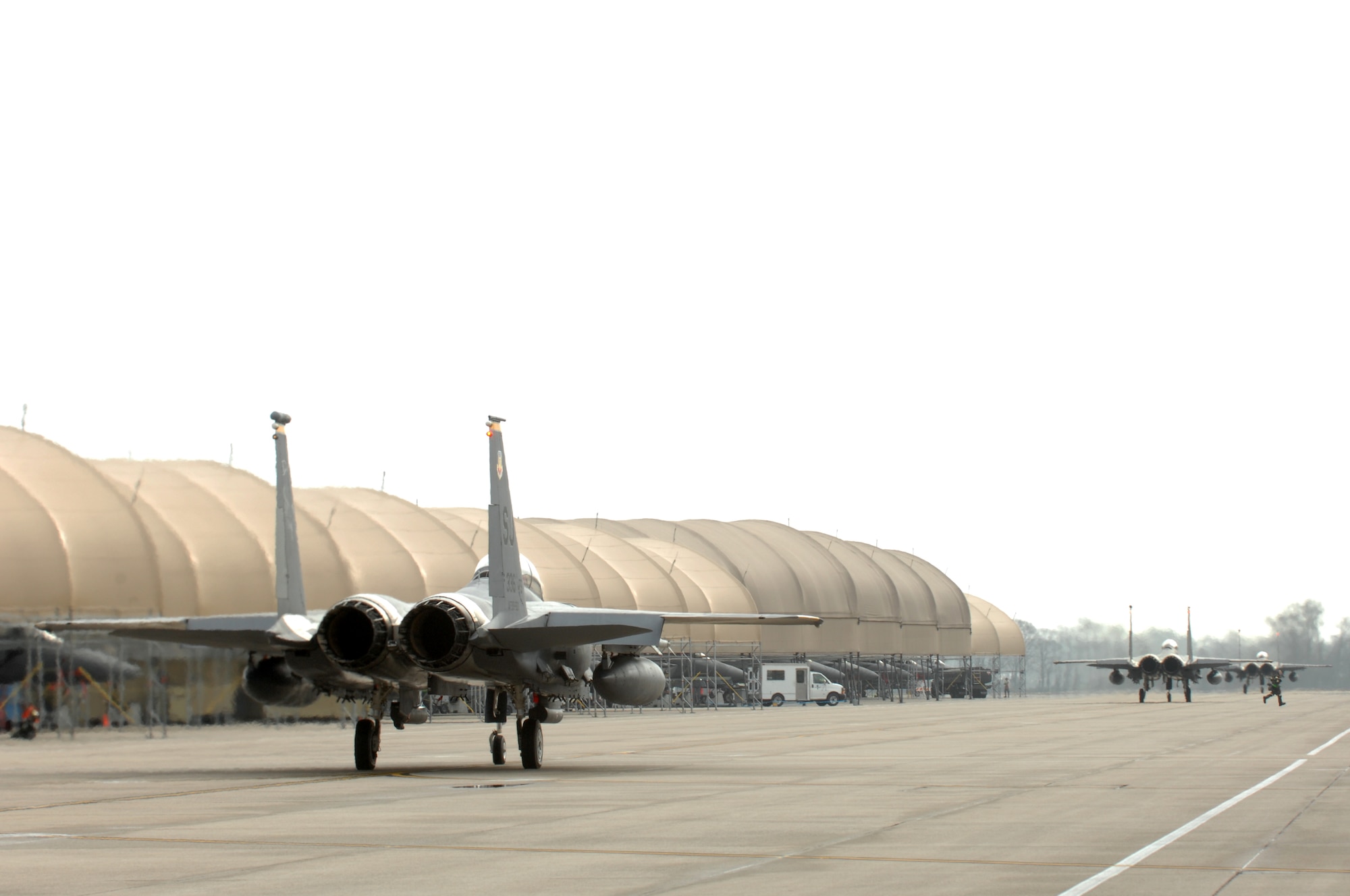 F-15E Strike Eagles taxi onto the flight line during Operational Readiness Exercise Coronet Warrior 13-01, at a simulated, deployed location on Seymour Johnson Air Force Base, N.C., Jan. 16, 2013. Strike Eagle aircrew simulated a deployment to eliminate enemy air and ground threats in addition to protecting the base. (U.S. Air Force photo/Airman 1st Class Aubrey White/Released)