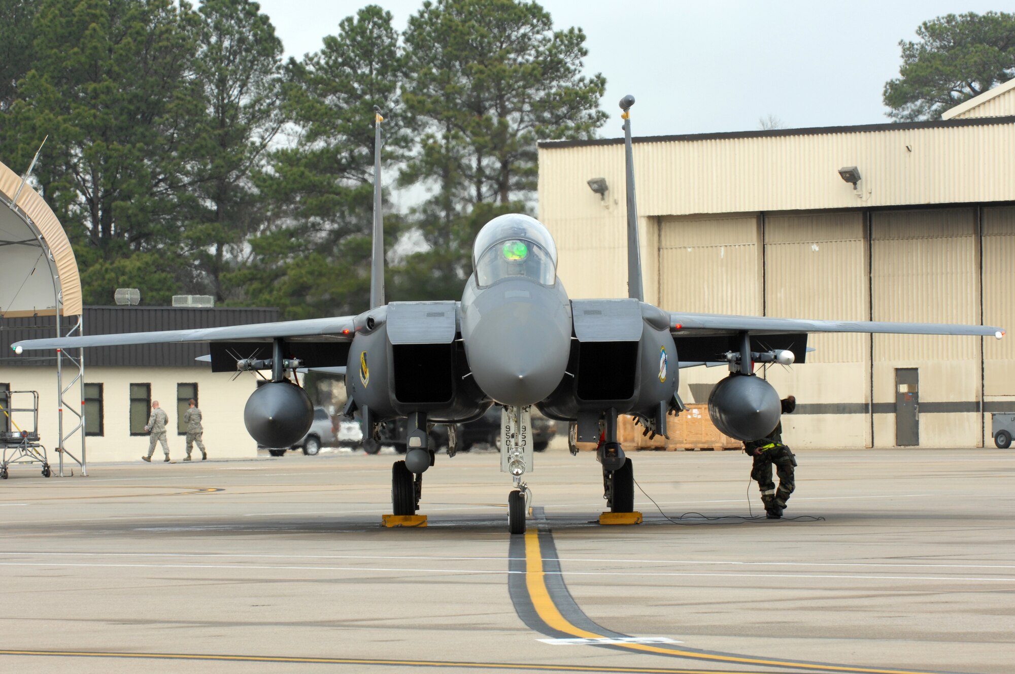 A U.S. Air Force Airman assigned to the 4th Aircraft Maintenance Squadron prepares an F-15E Strike Eagle for departure during Operational Readiness Exercise Coronet Warrior 13-01, at a simulated, deployed location on Seymour Johnson Air Force Base, N.C., Jan. 16, 2013. Maintenance personnel were tested on their ability to generate aircraft for takeoff during fluctuating force protection conditions and mission oriented protective postures. (U.S. Air Force photo/Airman 1st Class Aubrey White/Released)