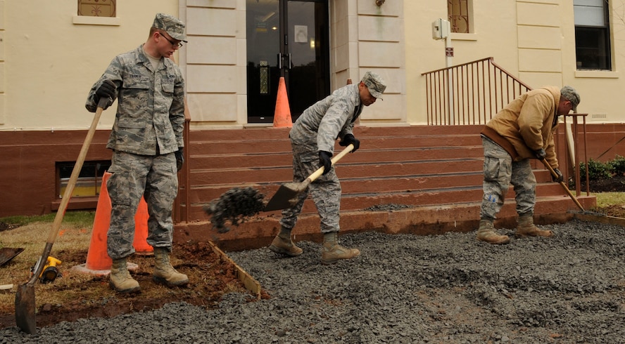 Airmen from the 2nd Civil Engineer Squadron shovel base coarse in preparation of laying down sidewalk on Barksdale Air Force Base, La., Jan. 16. The 2 CES has the responsibility of maintaining base infrastructure and setting up construction projects. (U.S. Air Force photo/Airman 1st Class Andrew Moua)
