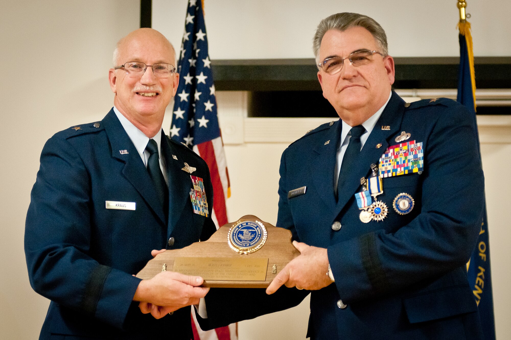Brig. Gen. Michael Dornbush (right), the outgoing director of Joint Staff at Joint Forces Headquarters-Kentucky, receives a plaque in recognition of 40 years of service from Brig. Gen. Mark Kraus, Kentucky’s assistant adjutant general for Air, during a retirement ceremony at the Kentucky Air National Guard Base in Louisville, Ky., on Jan. 12, 2013. Dornbush has served as a flight and squadron commander, a vice wing commander and a deployed group commander in support of Operation Enduring Freedom. (U.S. Air Force photo by Staff Sgt. Maxwell Rechel)