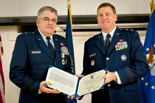 Brig. Gen. Michael Dornbush (left), the outgoing director of Joint Staff at Joint Forces Headquarters-Kentucky, receives the Distinguished Service Medal from Maj. Gen. Edward W. Tonini, Kentucky’s adjutant general, during a retirement ceremony at the Kentucky Air National Guard Base in Louisville, Ky., on Jan. 12, 2013. Dornbush served in the Air Force and Kentucky Air National Guard for more than 40 years. (U.S. Air Force photo by Staff Sgt. Maxwell Rechel)