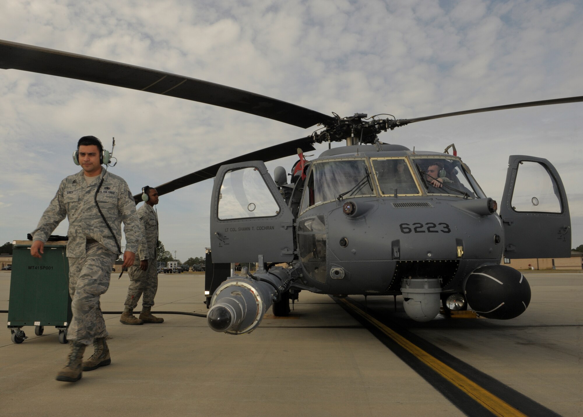 U.S. Air Force Tech. Sgt. Victor Gorza (left), Senior Airman Kenneth Crutchfield (middle), and Staff Sgt. Joshua Seymour, all electrical and environmental technicians with the 723d Aircraft Maintenance Squadron, work to fix a power problem on the hydraulic pump on an HH-60G Pave Hawk at Moody Air Force Base, Ga., Jan. 11, 2013. The lives of pilots and aircrew rely heavily on the technicians and their experience to properly maintain these aircraft to continue the Moody mission. (U.S. Air Force photo by Senior Airman Eileen Meier/Released)