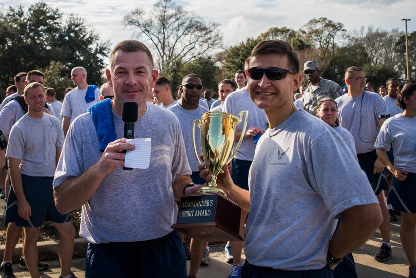 Col. Richard McComb, Joint Base Charleston commander, presents the Commander's Spirit Award to Lt. Col. Craig Punches, 628th Logistics Readiness Squadron commander, after the Martin Luther King Jr. Day 5k Run Jan. 11, 2013, at Joint Base Charleston – Air Base, S.C. The 5k was a tribute to Martin Luther King Jr., and served as a reminder of his accomplishments and sacrifices. (U.S. Air Force photo/Senior Airman George Goslin)