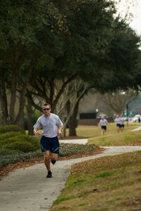 Capt. Austin McCann, 15th Airlift Squadron pilot, approaches the finish line during the Martin Luther King Jr. Day 5k Run Jan. 11, 2013, at Joint Base Charleston, S.C. McCann finished as the top male in the race with a time of 18:37 . The 5k was a tribute to Martin Luther King Jr., and served as a reminder of his accomplishments and sacrifices. (U.S. Air Force photo/Senior Airman George Goslin)