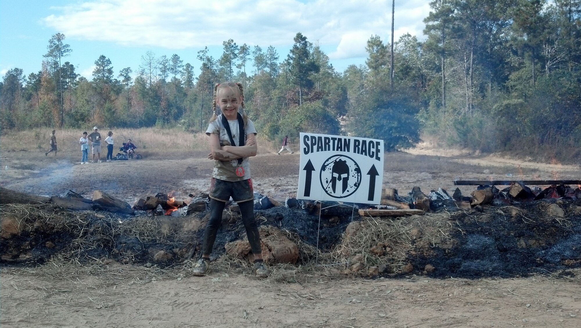 Emily Doane, 7, daughter of Jessica and Master Sgt. Michael Doane, 2nd Air Force, Keesler Air Force Base, Miss., got down-and-dirty for the Spartan Mud Run obstacle race Nov. 10, 2012, in Perkinston, Miss.  Emily was born nine weeks premature with underdeveloped lungs, spent a month in neonatal intensive care and was diagnosed with asthma when she was 4 years old.  She is involved in physical activities to help strengthen her lungs and deal with the affects of asthma.  (Courtesy photo)