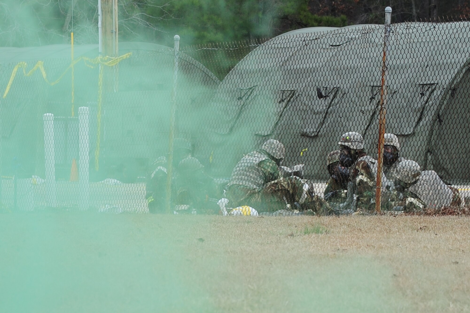 U.S. Air Force Airmen don protective gear during a simulated chemical attack on Seymour Johnson Air Force Base, N.C., Jan. 16, 2013. The simulated attack was one of several during Phase II of Coronet Warrior 13-01, testing Airmen’s ability to survive and operate in a deployed environment. (U.S. Air Force photo/Airman 1st Class Mariah Tolbert/Released)