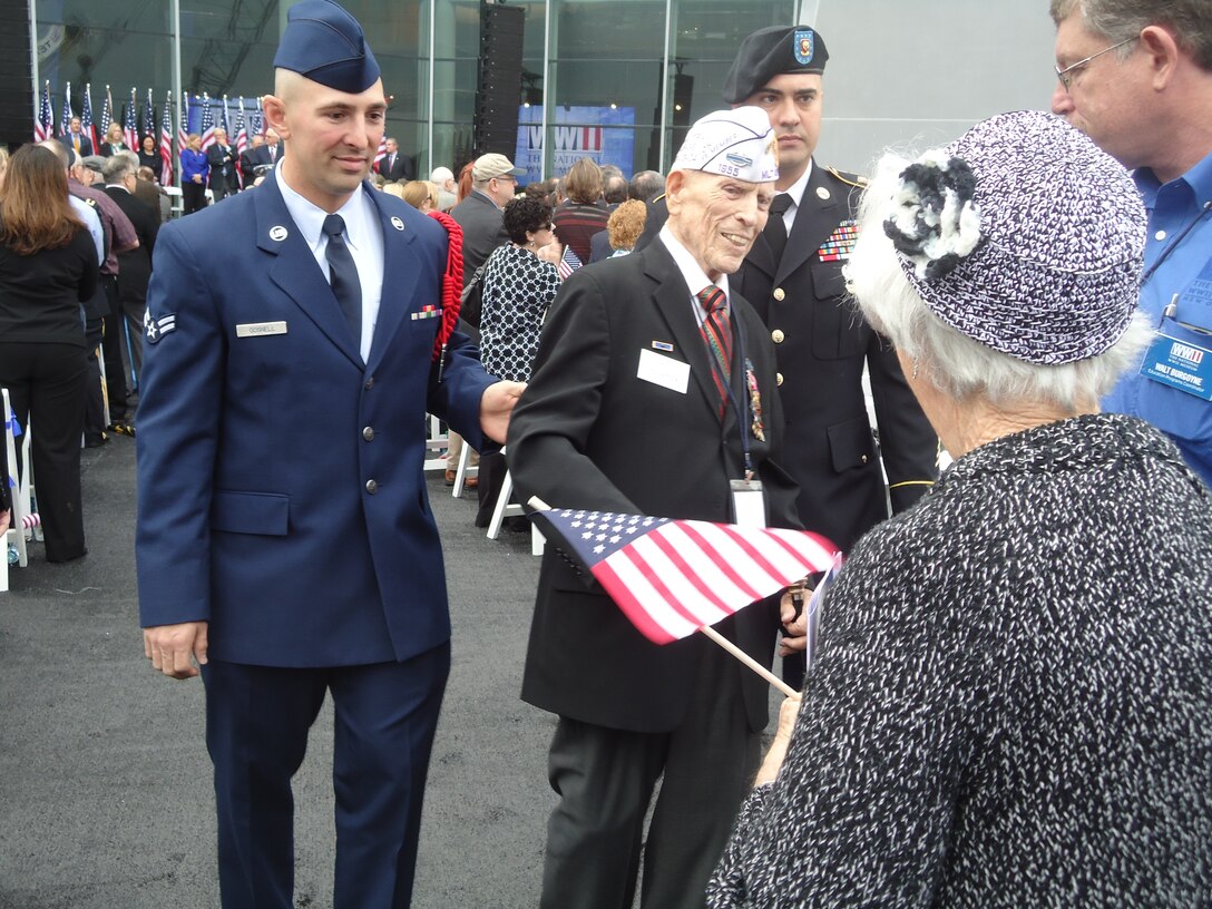 Airman 1st Class Nelson Gosnell Jr., 336th TRS, escorts 91-year-old J.J. Witmeyer, an Army veteran from World War II.  Witmeyer received two Purple Hearts and many other decorations for his service.  (U.S. Air Force photo by Susan Griggs)