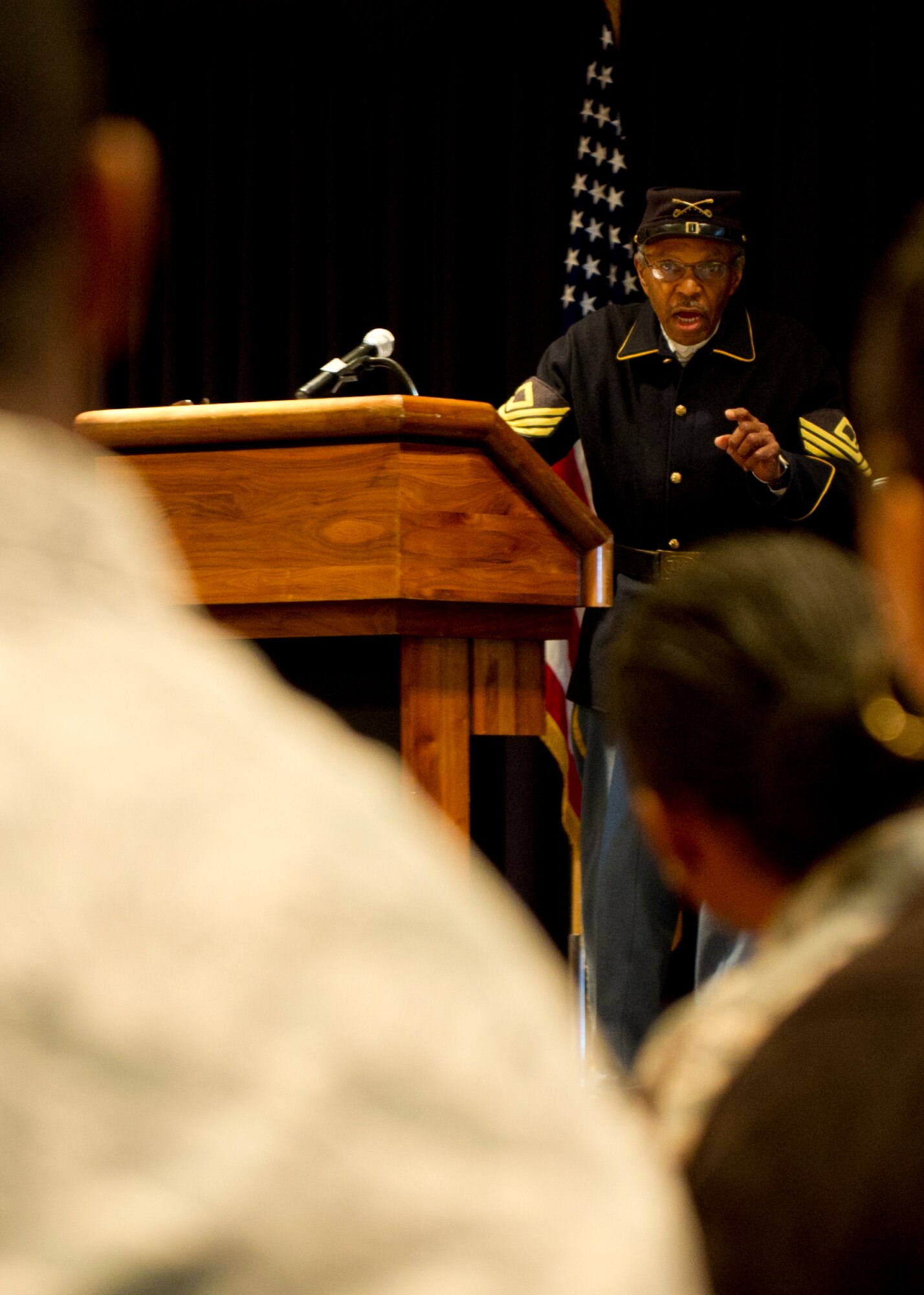 Retired Army Command Sgt. Maj. Charles Taylor Jr., Buffalo Soldier reenactor, El Paso, Texas, speaks at the Dr. Martin Luther King Jr. Remembrance Day Luncheon at Holloman Air Force Base, N.M., Jan. 15. Taylor talked about historical people and events that led up to Dr. King and how Dr. King’s actions changed the nation. (U.S. Air Force photo by Senior Airman Kasey Close/Released)