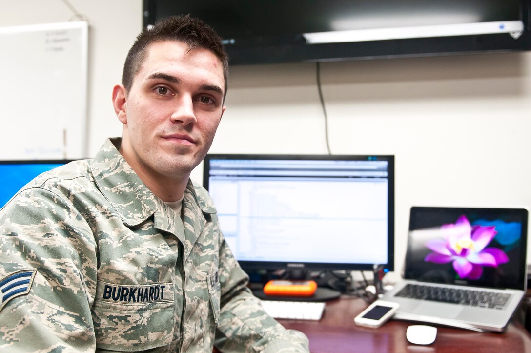 Senior Airman Daniel Burkhardt, an Air Force broadcast journalist currently supporting Joint Task Force, National Capital Region, a task force of Department of Defense military and civilian personnel stood up in support of the 57th Presidential Inauguration, put the finishing touches on a cellphone application Jan. 14 that he and his supervisor designed from the ground up to provide real time information on the historic event. The app, called ,"Inauguration," was released by Apple Inc., Jan. 14 and is currently available through the corporation's App Store. (U.S. Army photo by Sgt. Christopher M. Gaylord, 5th Mobile Public Affairs Detachment)