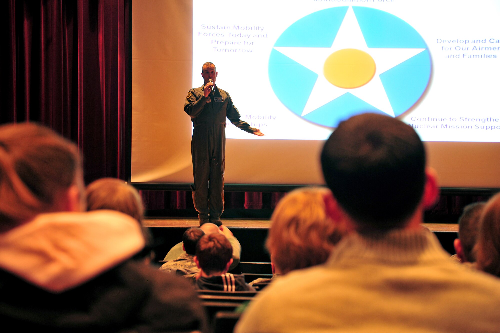 Col. Brian Newberry, 92nd Air Refueling Wing commander, speaks during the town hall meeting in the base theater at Fairchild Air Force Base, Wash., Jan. 15, 2013. Newberry discussed many topics, including upcoming changes to health care, national budget updates, housing issues, and other subjects. The colonel also talked about events happening this year such as Skyfest and the Lilac Festival. (U.S. Air Force photo by Senior Airman Taylor Curry)