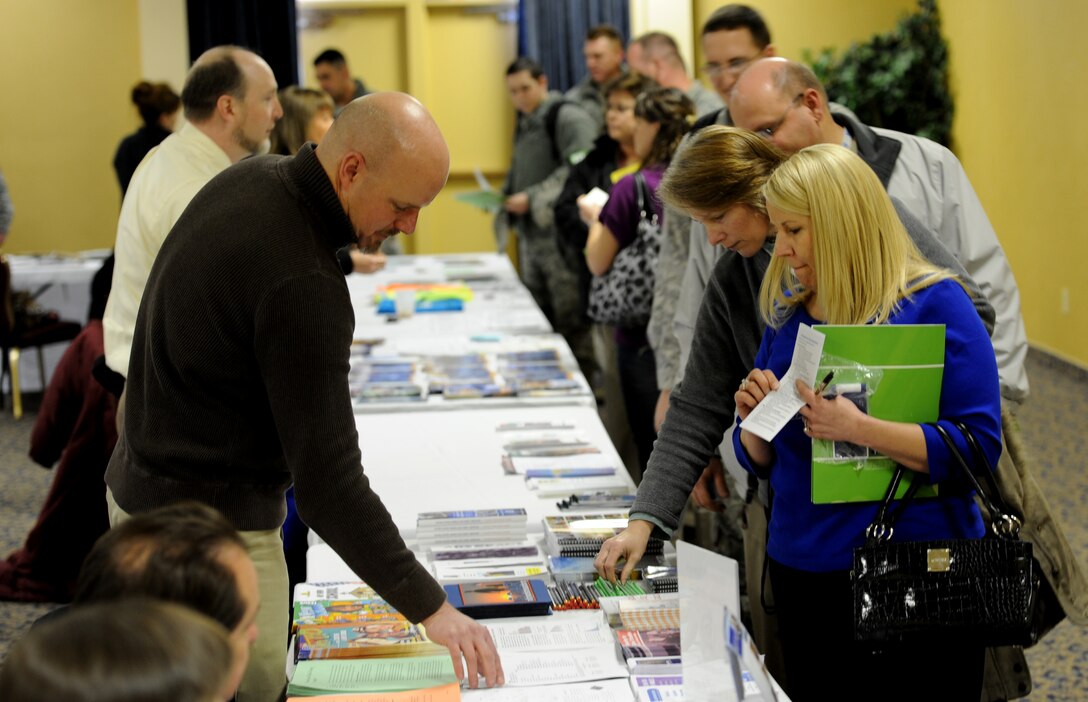 Chad Canaan, 28th Force Support Squadron school liaison officer, provides information about school systems in the surrounding area to Airmen and their families during Happy Landings in the Dakota’s Club at Ellsworth Air Force Base, S.D., Jan. 15, 2013. Happy Landings, a monthly fair for both newcomers to Ellsworth and those who’ve been around for a while, gave those who attended a crash course on all the services Ellsworth has to offer. (U.S. Air Force photo by Airman 1st Class Hrair H. Palyan/Released)