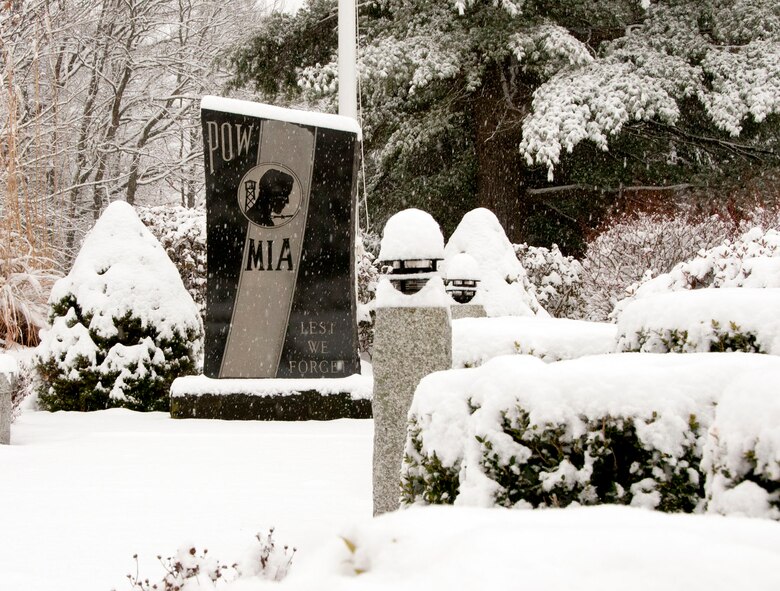 HANSCOM AIR FORCE BASE, Mass. – Snow accumulates around the POW/MIA memorial on Barksdale Street Jan. 16. The base and surrounding areas saw several inches of snow this week. (U.S. Air Force photo by Mark Wyatt)