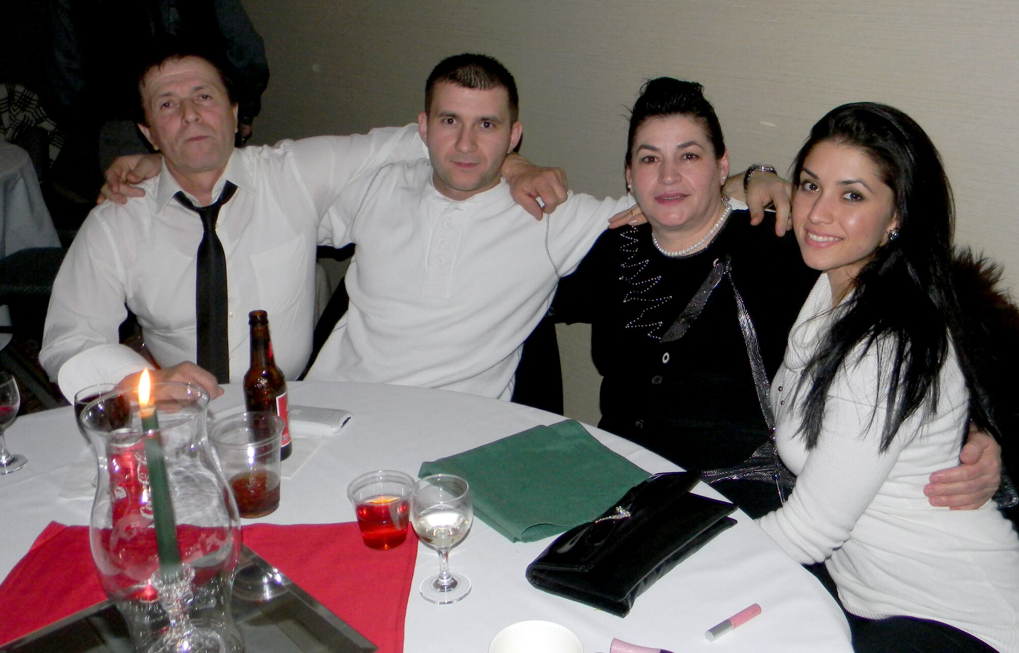 Staff Sgt. Ivanka Vrechkov (right), poses with her father Alexi Stefanov, brother Petko Stefanov and mother Rusanka Stefanova in Varna, Bulgaria. Vrechkov, a Knowledge Operations Manager assigned to the Air Force Reserve Policy and Integration Office in the Pentagon, landed two spots at the President's Inauguration Military Ball Jan. 21. Vrechkov, a naturalized American citizen, feels very lucky to be attending this historic event. “I came from a little village in Bulgaria and now I’m going to be at a party with the President of the United States – the greatest nation on earth. It feels surreal.” (Courtesy photo) 