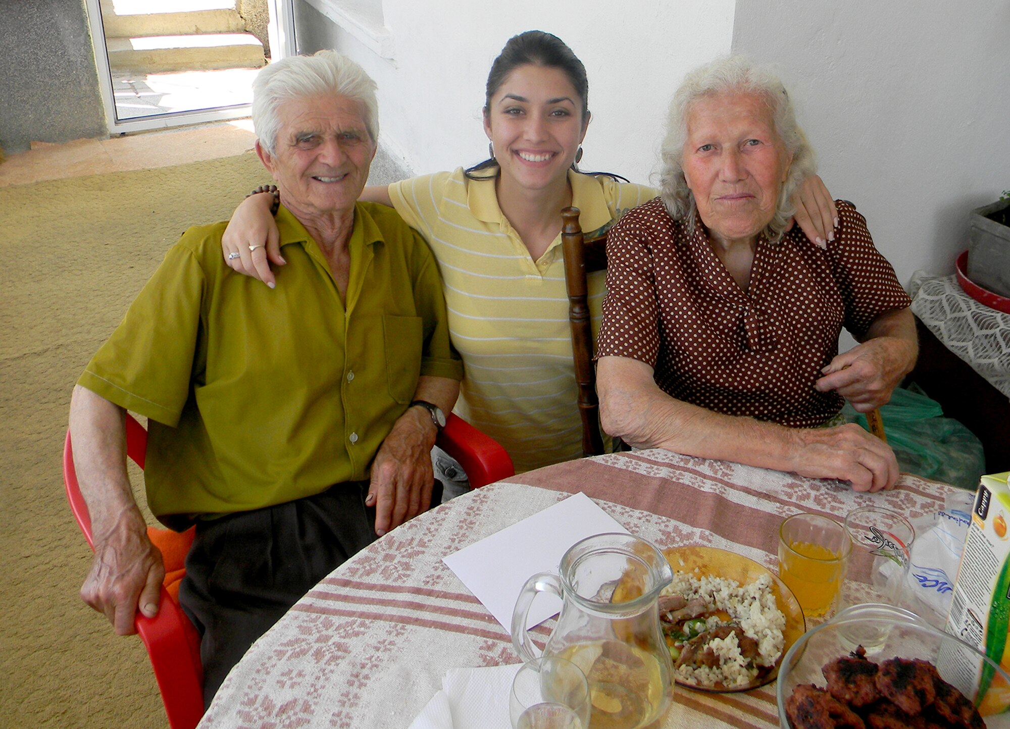 Staff Sgt. Ivanka Vrechkov poses with her grandparents, Pene Stefanov  and Ruska Stefanova  in Varna, Bulgaria. Vrechkov, a Knowledge Operations Manager assigned to the Air Force Reserve Policy and Integration Office in the Pentagon, landed two spots at the President's Inauguration Military Ball Jan. 21. Vrechkov, a naturalized American citizen, feels very lucky to be attending this historic event. “I came from a little village in Bulgaria and now I’m going to be at a party with the President of the United States – the greatest nation on earth. It feels surreal.” (Courtesy photo)
