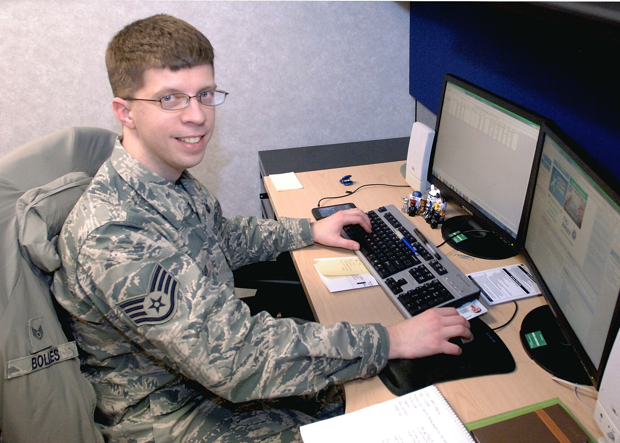 Staff Sgt. Kyley Bolles, budget analyst for the 319th Comptroller Squadron, reviews available funds for base organizations Jan. 10, 2013, on Grand Forks Air Force Base, N.D. Bolles is currently studying to get his bachelor’s degree in information technology. (U.S. Air Force photo/Airman 1st Class Zachiah Roberson)