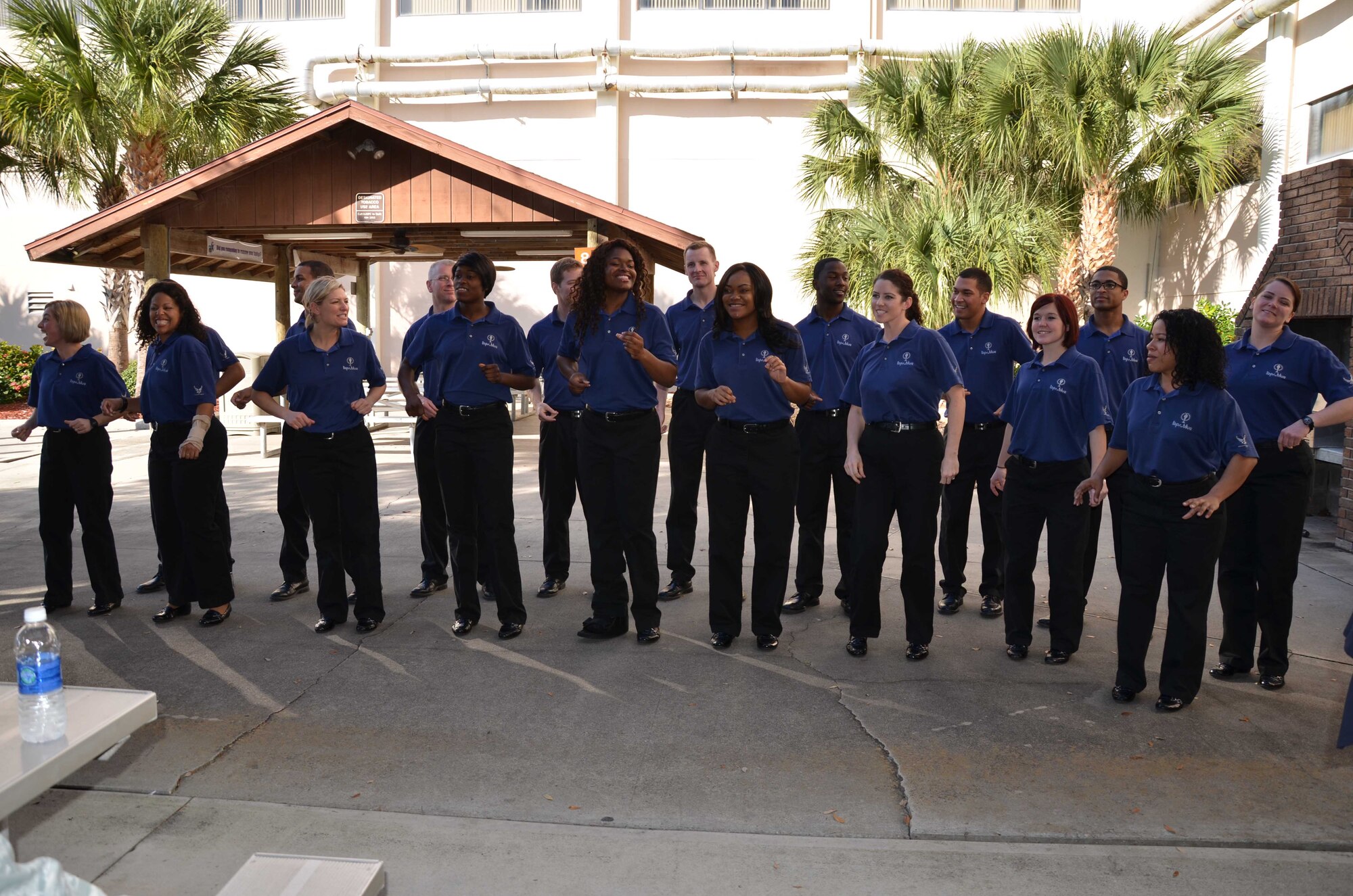 Twenty vocalists, including Senior Airman Kerrilee Meeker, (far left) of Tops in Blue paid a visit to the Air Force Technical Applications Center to sing a few songs from their repertoire and present the AFTAC commander with a plaque of appreciation for giving Meeker the opportunity to travel with the entertainment group for a year.  “The men and women of AFTAC are an extremely talented group of people, and getting to see another facet of the rich talent that is within my organization is just such a treat,” said Col Chris Worley, AFTAC commander.  “Airman Meeker has represented AFTAC across the globe and served as an ambassador for the Air Force." (U.S. Air Force photo by Susan A. Romano)