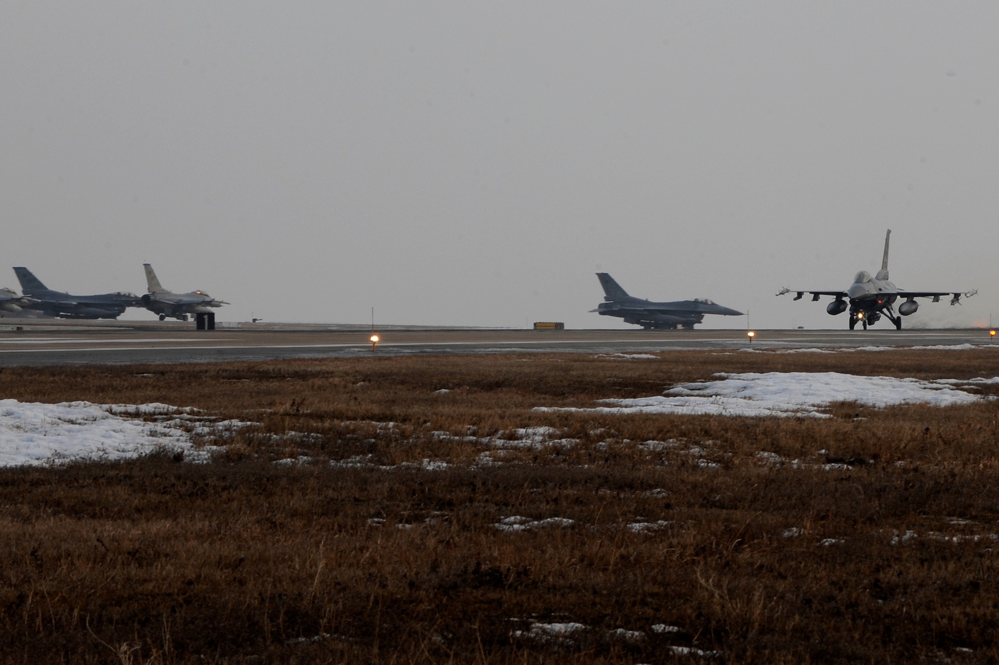 F-16 Fighting Falcons with the 8th Fighter Wing prepare to take off during Exercise Beverly Midnight 13-1 at Kunsan Air Base, Republic of Korea, Jan. 16, 2013. The exercise is an assessment of U.S. and ROK air forces capabilities and combat readiness. (U.S. Air Force photo by Senior Airman Marcus Morris/Released)