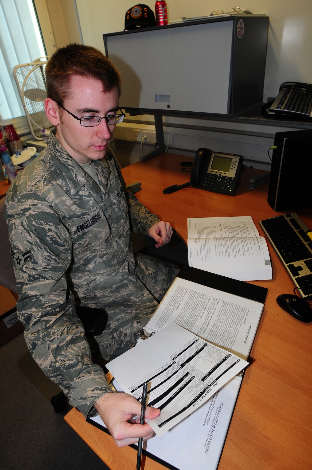 ROYAL AIR FORCE LAKENHEATH, England -- Airman 1st Class Craig Engelbrecht, 48th Communications Squadron communication security accountant, reviews accounts Jan. 16, 2013. Engelbrecht was nominated for a Liberty Spotlight, because he displays the core value of "Excellence in All We Do." (U.S. Air Force photo by Airman 1st Class Dana J. Butler)

