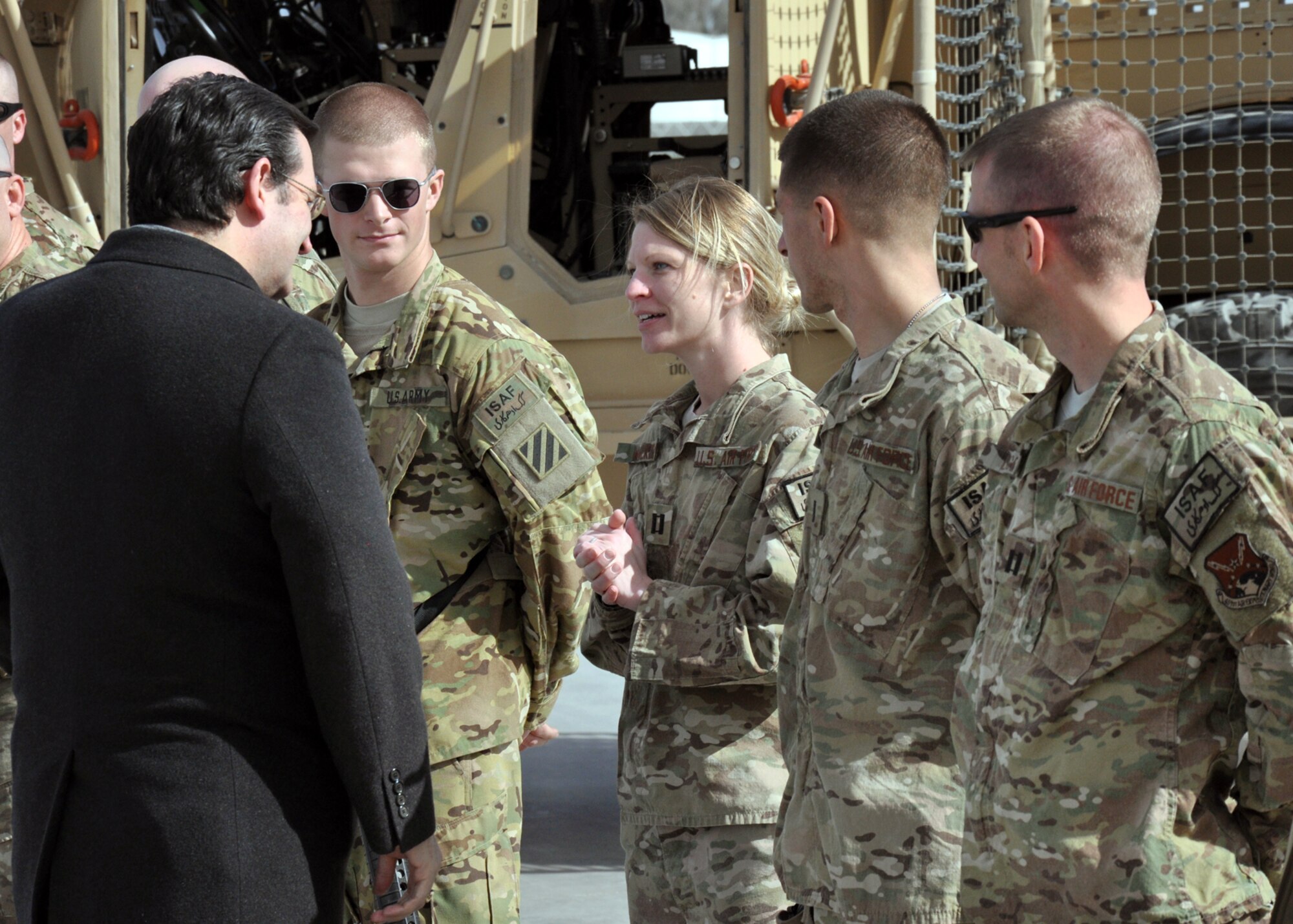 U.S. Air Force Capt. Erin Walker, 451st Air Expeditionary Wing command staff, speaks with U.S. Senator-Elect Ted Cruz (R-TX) during the Senator’s visit to Kandahar Jan. 14. Cruz along with U.S. Senators Mitch McConnell (R-KY), John Barasso (R-WY) and Senator-Elects Jeff Flake (R-AZ) and Deb Fischer (R-NE) visited Regional Command-South leadership, Soldiers and Airmen. The purpose of the visit was to discuss the political, economic and security issues affecting bilateral and regional relationships in the RC-South area of operations. (U.S. Air Force photo/Master Sgt. Russell Martin)