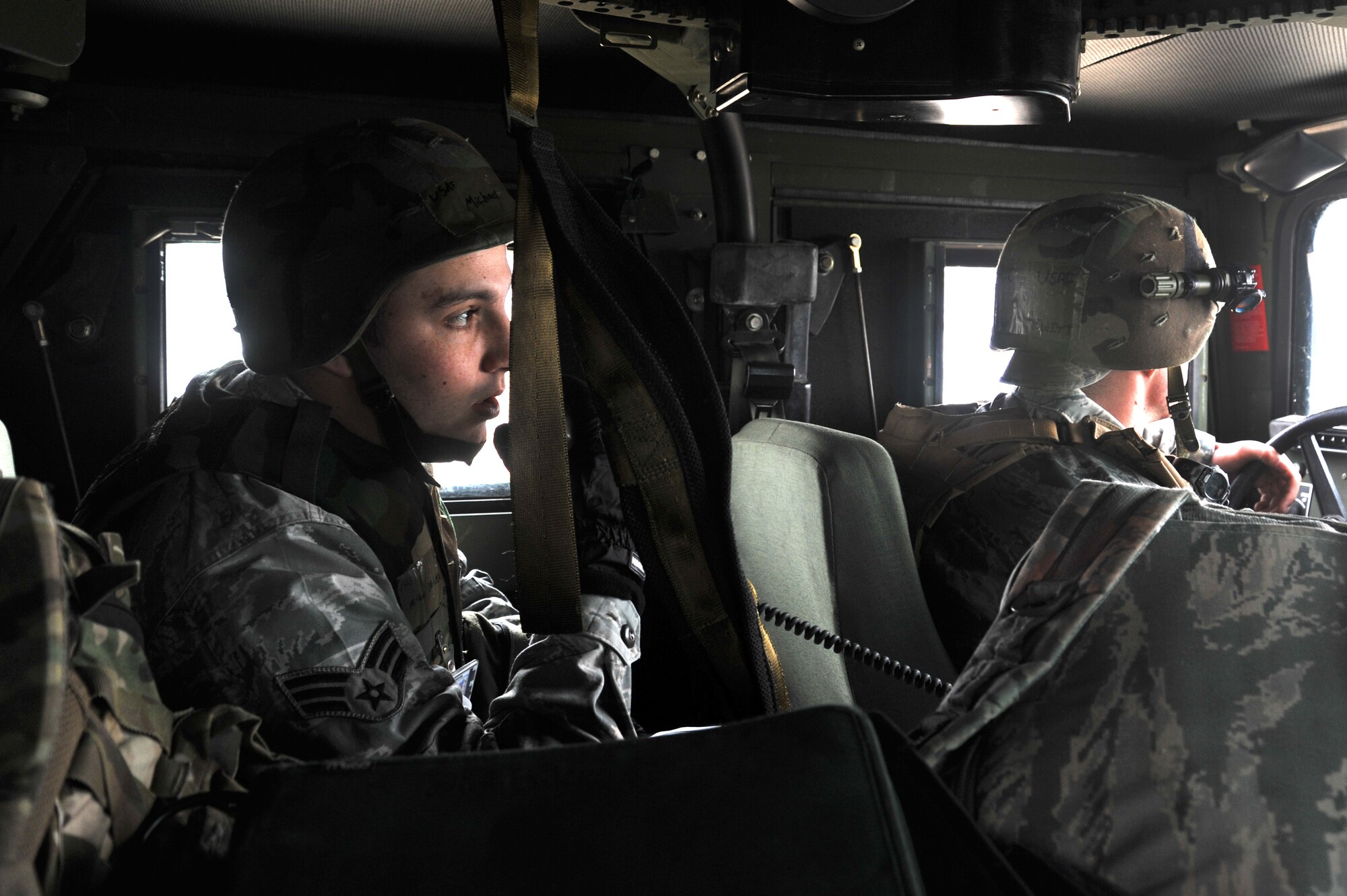 Senior Airman Michael Banner (left) and Airman 1st Class Shawn Hewitt, 51st Civil Engineer Squadron Explosive Ordinance Disposal Flight technicians, report an Unexploded Ordinance on a simulated flight line to the Emergency Operations Center on Osan Air Base, Republic of Korea, Jan. 14, 2013. The team reports all UXO’s, craters and damange made to the flight line runway to give officials a better idea of conditions for the takeoff and landing of aircraft. (U.S. Air Force photo/Staff Sgt. Emerson Nunez)