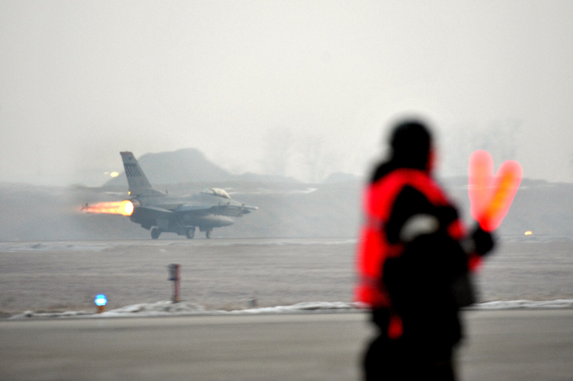 An F-16 launches during the first combat sortie for operational readiness exercise Beverley Midnight 13-01 from Osan Air Base, Republic of Korea, Jan. 15 2013.  This is Osan Airmen’s first simulated wartime contingency exercise executed in 2013 that will test the base’s ability to defend and execute the mission in a heightened state of readiness. (U.S. Air Force photo/Staff Sgt. Emerson Nuñez)