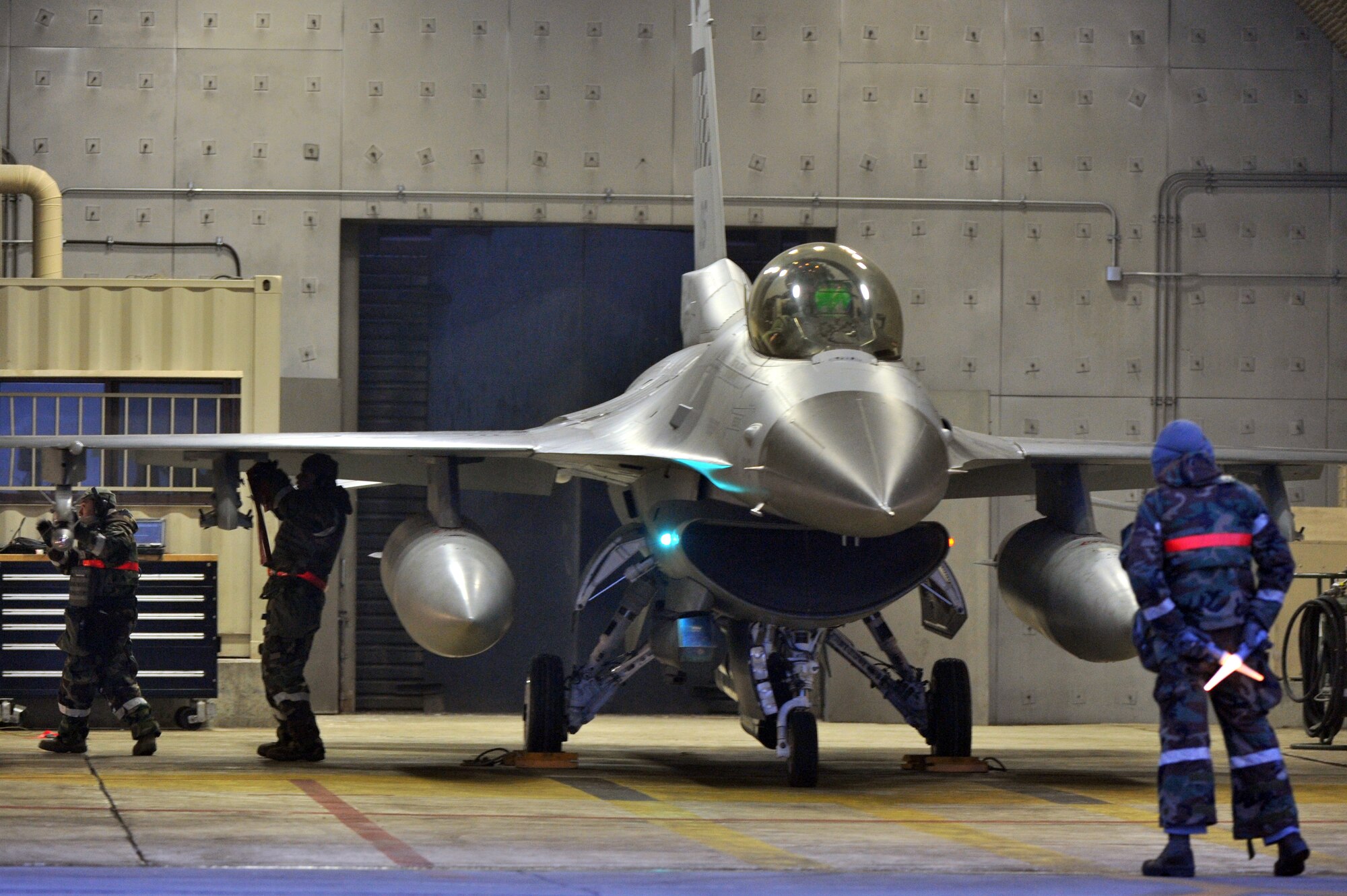 Airmen with the 36th Aircraft Maintenance Unit prepare an F-16 for the first combat sortie of operational readiness exercise Beverley Midnight 13-01 from Osan Air Base, Republic of Korea, Jan. 15 2013. Osan participates in these exercises so Airmen can demonstrate their capabilities and ability to perform in heightened awareness situations. (U.S. Air Force photo/Staff Sgt. Emerson Nuñez)