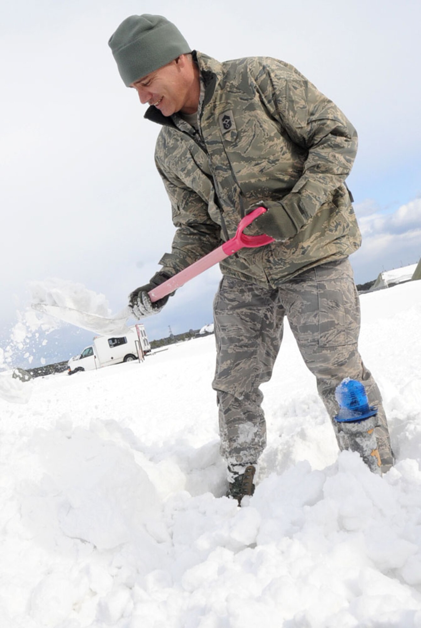 U.S. Air Force Chief Master Sgt. James Laurent, 35th Fighter Wing command chief, shovels snow on the flightline during the Command Chief’s dirty jobs program at Misawa Air Base, Japan, Jan. 15, 2013. With America Forces Network-Misawa’s help, the dirty jobs program will be aired as a commercial for base-wide viewing. (U.S. Air Force photo by Airman 1st Class Kenna Jackson)