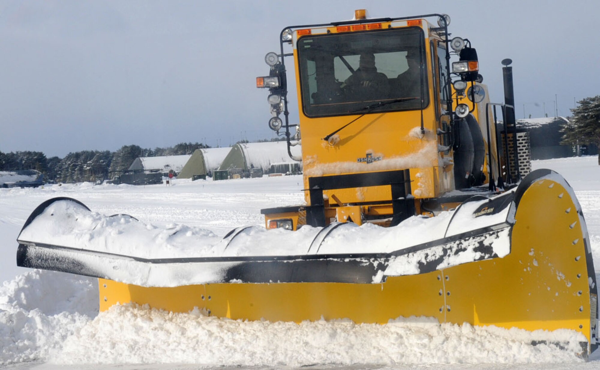 U.S. Air Force Col. Stephen Williams, 35th Fighter Wing commander, clears the flightline of fresh, powder snow during the Command Chief’s dirty jobs program at Misawa Air Base, Japan, Jan. 15, 2013. The program is engineered to allow Airmen a chance to showcase their daily lives on the job to leadership. (U.S. Air Force photo by Airman 1st Class Kenna Jackson)