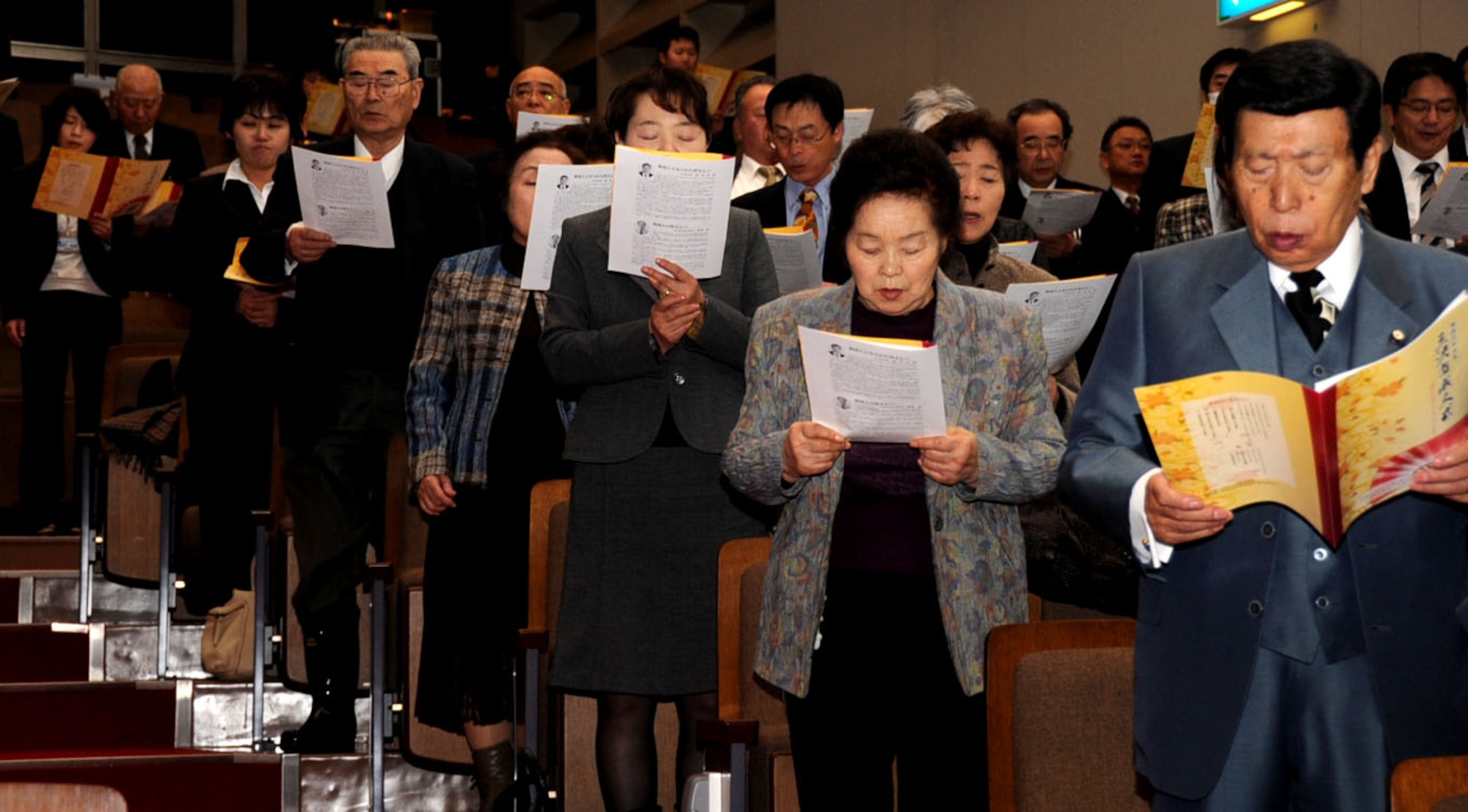 Japanese elders and family members sing the Misawa City song at the end of the Coming of Age Day Ceremony at the Misawa Civic Center in Misawa City, Japan, Jan. 13, 2013. Many Japanese elders attended the ceremony to welcome the new members of the adult society. (U.S. Air Force photo by Airman 1st Class Kenna Jackson)