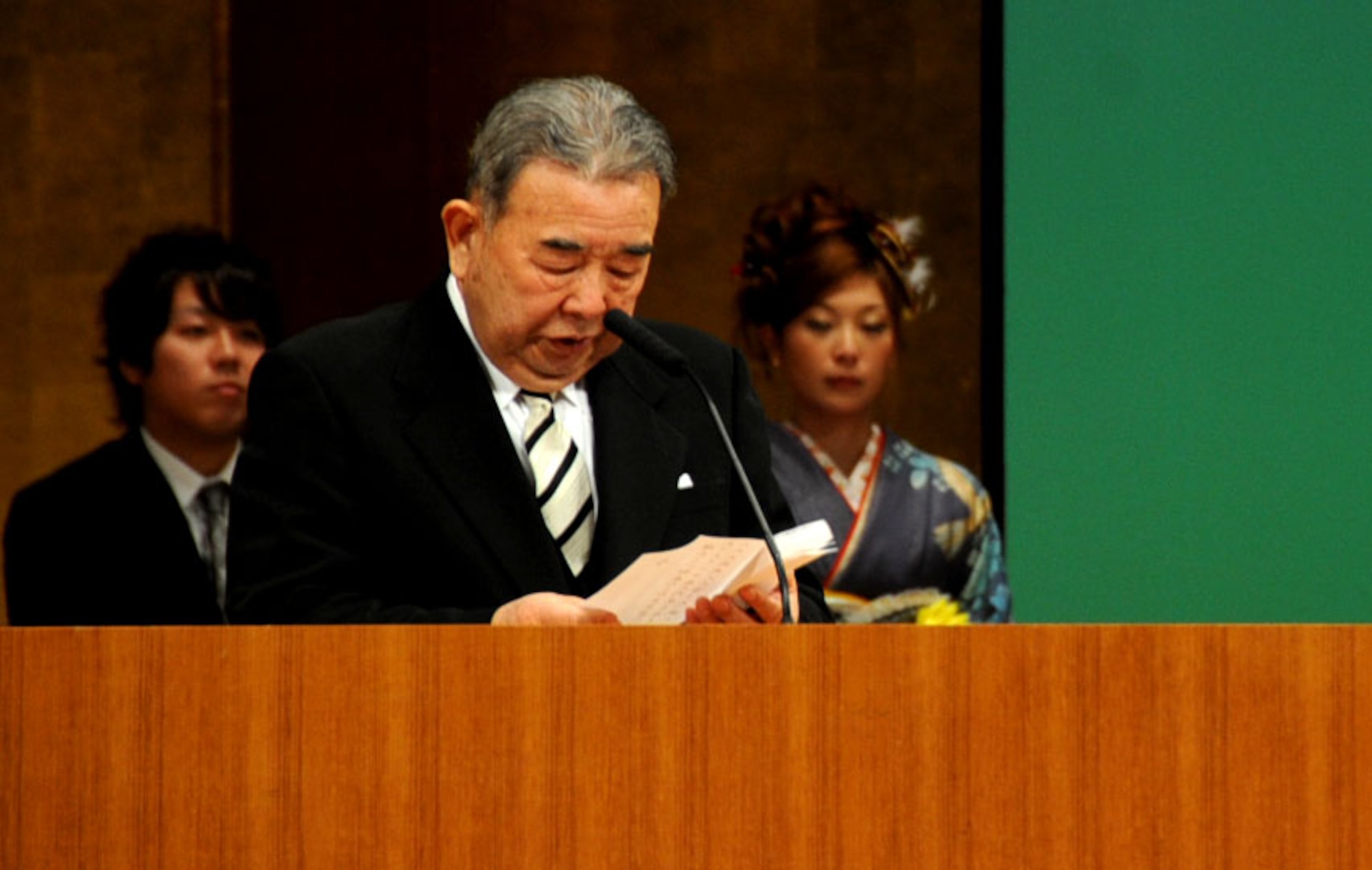 Kazumasa Taneichi, Misawa City Mayor, speaks to the new members of the adult society during the Coming of Age Day Ceremony at the Misawa Civic Center in Misawa City, Japan, Jan. 13, 2013. During his speech, the mayor asked for the young people to remember their teachings and fulfill their dreams. (U.S. Air Force photo by Airman 1st Class Kenna Jackson)