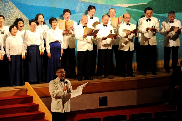 Members of the Satsuki, Cherry and Misawa City boys and girls choirs sing during the Coming of Age Day Ceremony at the Misawa Civic Center in Misawa City, Japan, Jan. 13, 2013. This ceremony is always held in the second week of January. The ceremony is held to honor the 20-year-old young adults’ rite of passage and has been passed down as a Japanese tradition since the Edo period. Edo, or Tokugawa, period is the years 1603 to 1868 in Japanese history. (U.S. Air Force photo/Airman 1st Class Kenna Jackson) 
