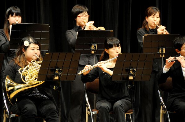 Members of the Claire-Wind Orchestra play during the Coming of Age Day Ceremony at the Misawa Civic Center in Misawa City, Japan, Jan. 13, 2013. Every town has their own ceremony, if the honored person has left their hometown, it is custom for them to return. (U.S. Air Force photo/Airman 1st Class Kenna Jackson) 
