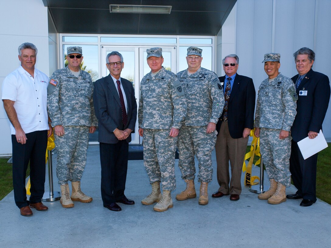 Rep. Alan Lowenthal, third from left, takes part in ribbon cutting ceremonies Jan. 12 for the newest addition to the Joint Forces Training Base in Los Alamitos, Calif.; the 79th Sustainment Support Command’s 53,000 square-foot U.S. Army Reserve Center. Joining Lowenthal are, from the left, contract partner Todd Gillum, 40th Inf. Div. Commander Brig. Gen. Keith Jones, 79th SSC Commander Maj. Gen. William D. Frink, Jr.,  63rd Regional Support Command Commander Maj. Gen. Michael Schweiger, Cypress Mayor Pro Tem Leroy Mills, Los Angeles District Commander Col. Mark Toy, and Los Alamitos City Councilman Dean Grose. The nearly $29 million project is managed by the Corps and includes a state-of-the-art 12,500 square-foot organizational maintenance shop and more than 28,000 square-feet in organizational parking. 