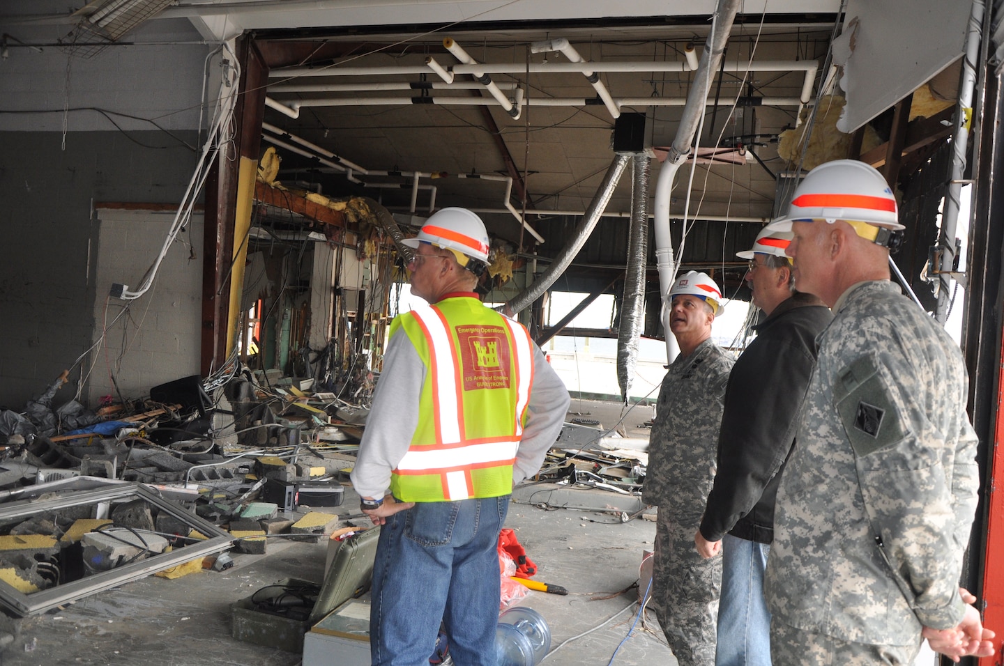 U.S. Army Corps of Engineers senior leaders assess the damages to New York District's Caven Point Marine Terminal Nov. 2, 2012, where the District’s marine operations are based out of. Despite the marine terminal suffering extensive damages, New York District personnel have continued to support missions to support safe navigation of the New York and New Jersey Harbor, including working with the U.S. Coast Guard to conduct hydrographic surveys to map the safest routes for shipping and other vessels and through drift collection vessels working to clear tons of drift and debris from Hurricane Sandy that could be hazardous to navigation. New York District is also supporting other U.S. Army Corps of Engineers efforts throughout the region as well in support of FEMA. (photo by Chris Gardner, New York District public affairs)