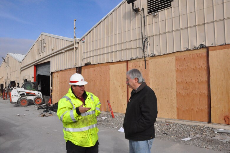 Tony Lauria and John Tavolaro of the U.S. Army Corps of Engineers, New York District's Operations Division discuss the progress of cleanup efforts November 19, 2012 at the District's Caven Point Marine Terminal in New Jersey after Hurricane Sandy severely damaged the facility weeks earlier. (photo by Chris Gardner, New York District public affairs)