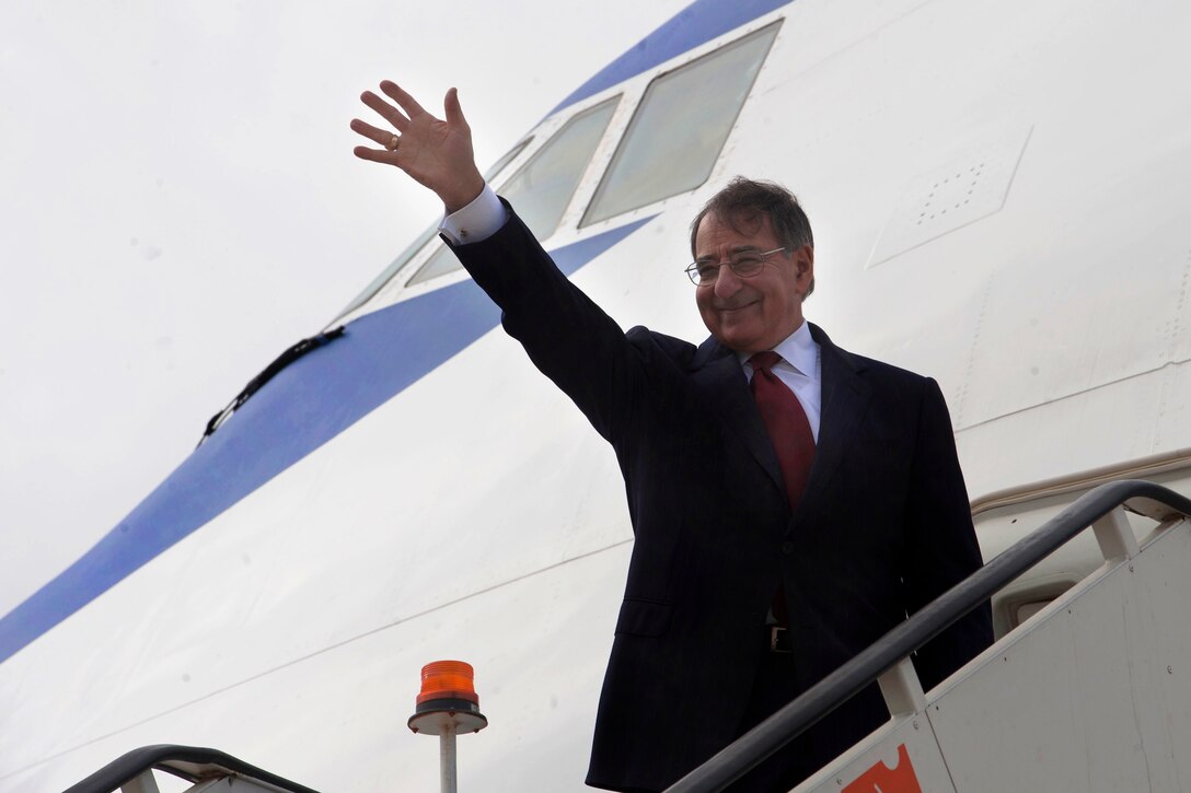 U.S. Defense Secretary Leon E. Panetta waves good-bye upon his departure in Lisbon, Portugal, Jan. 15, 2013.