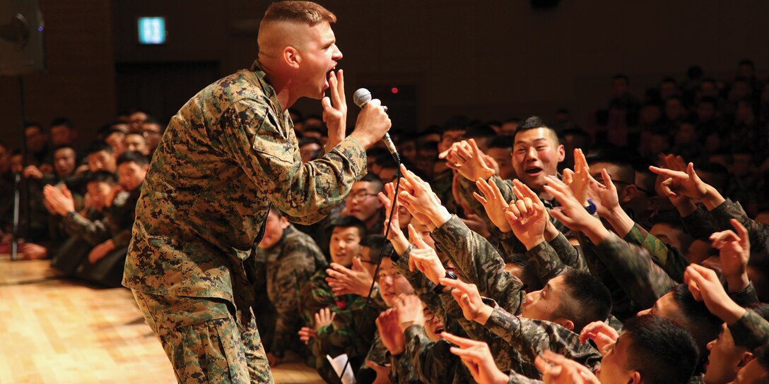 Lance Cpl. Zachary T. Jones sings for Republic of Korea Marines as part of the III Marine Expeditionary Force pop and rock band’s performance Jan. 13 at the ROKMC 1st Marine Division headquarters in Pohang, Republic of Korea. The III MEF’s ceremonial and party bands also played for the Korean Marines, who appreciated the high-quality performances.  Jones is a vocalist for the III MEF rock band. 
